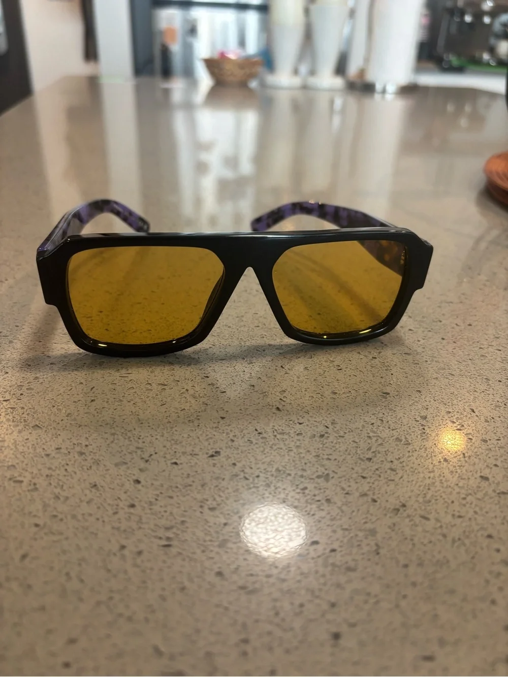 Prada Black Frame Sunglasses with Amber Yellow Lenses